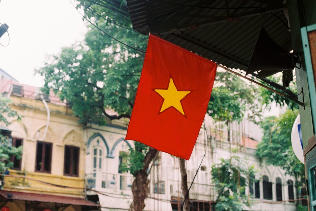 Low angle view vietnamese flag hanging building