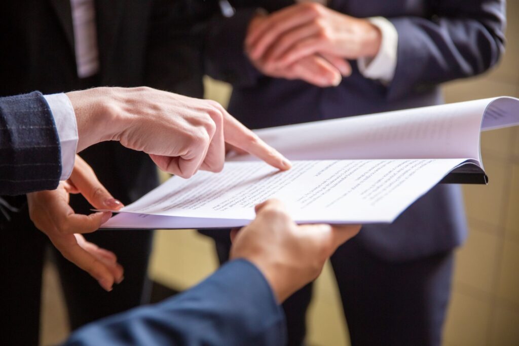 Cropped view businesswomen reading document
